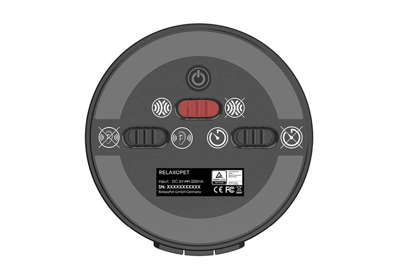RelaxoPet anxiety relief Training device for dogs with control buttons and power switch on a circular black base