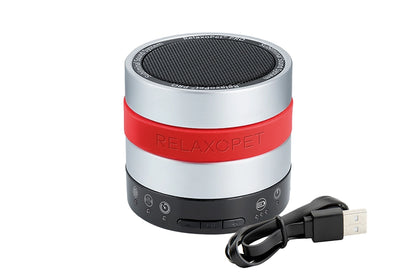 RelaxoPet anxiety relief Training device for dogs with compact silver and red design and USB charging cable
